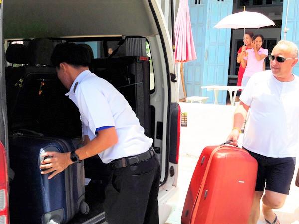 Load luggage into minivan