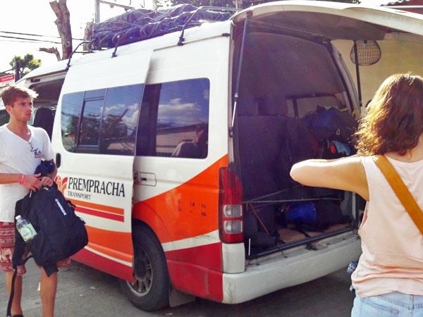 Load luggage into Prempracha Transport minivan